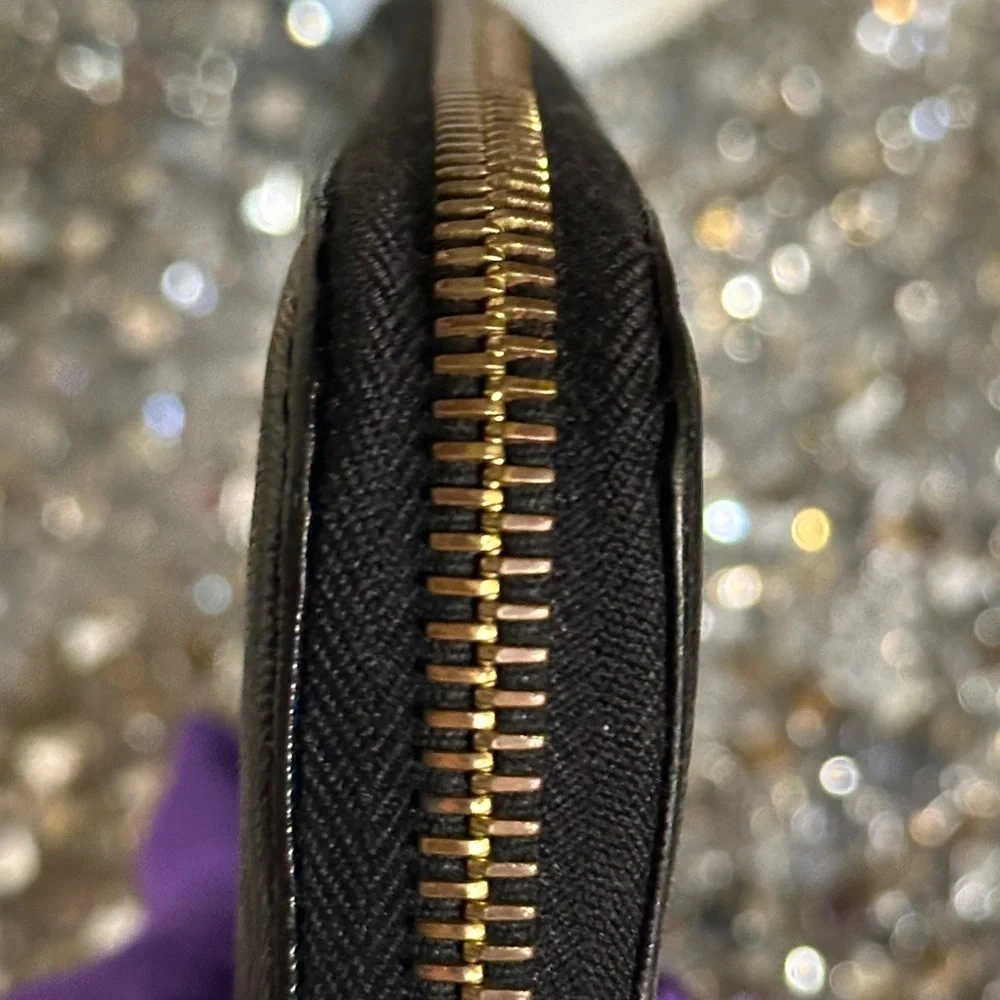Vintage Fendi black patent leather zip-around continental wallet.